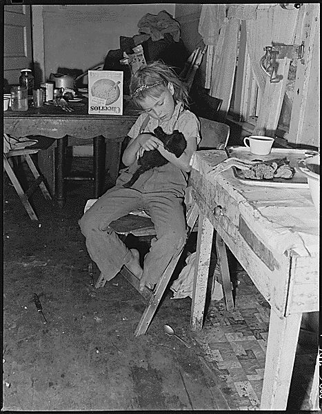 Daughter of Charles B. Lewis, miner, holding her kitten