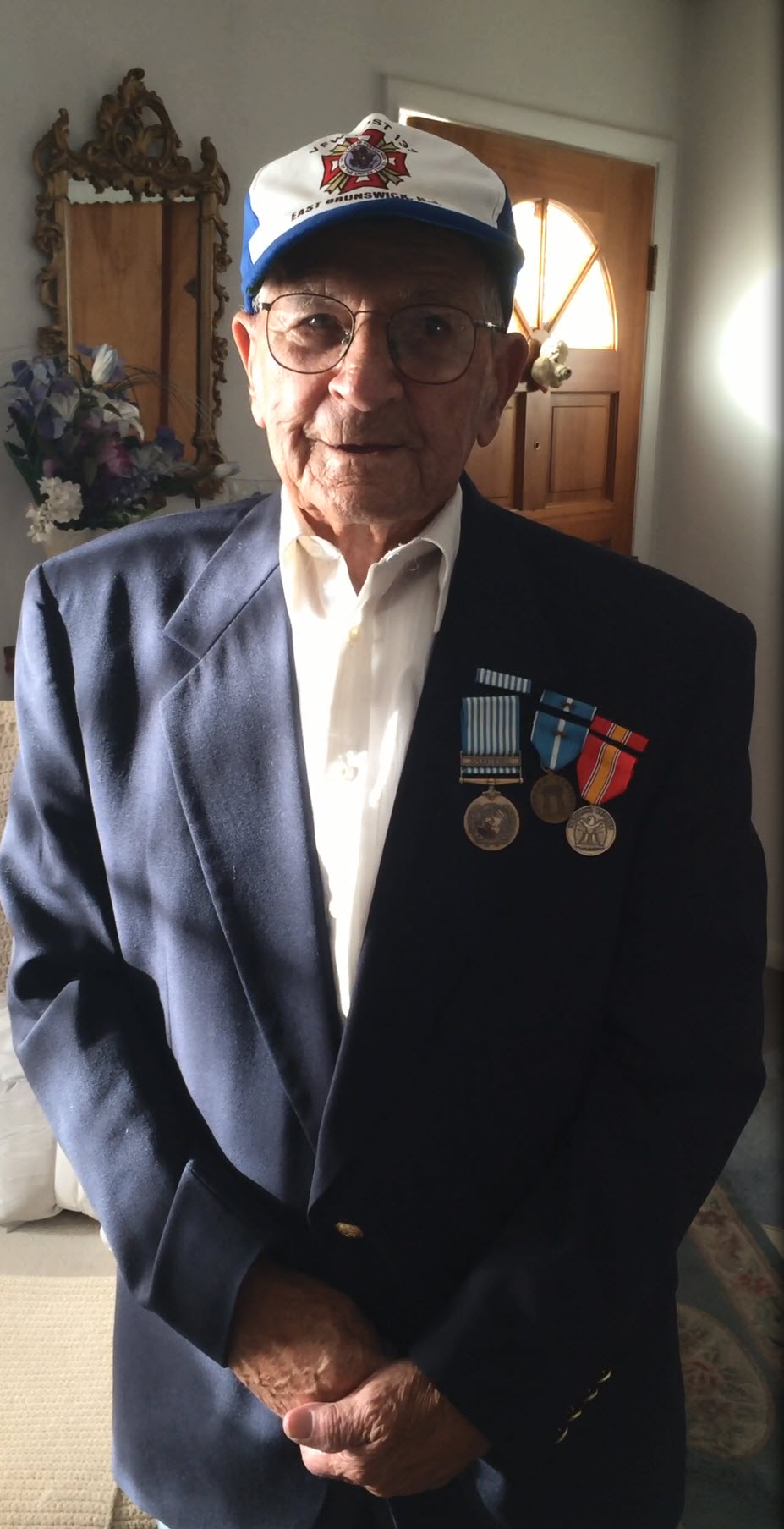 Photo of Mr. John Joseph Scala proudly displaying his service medals