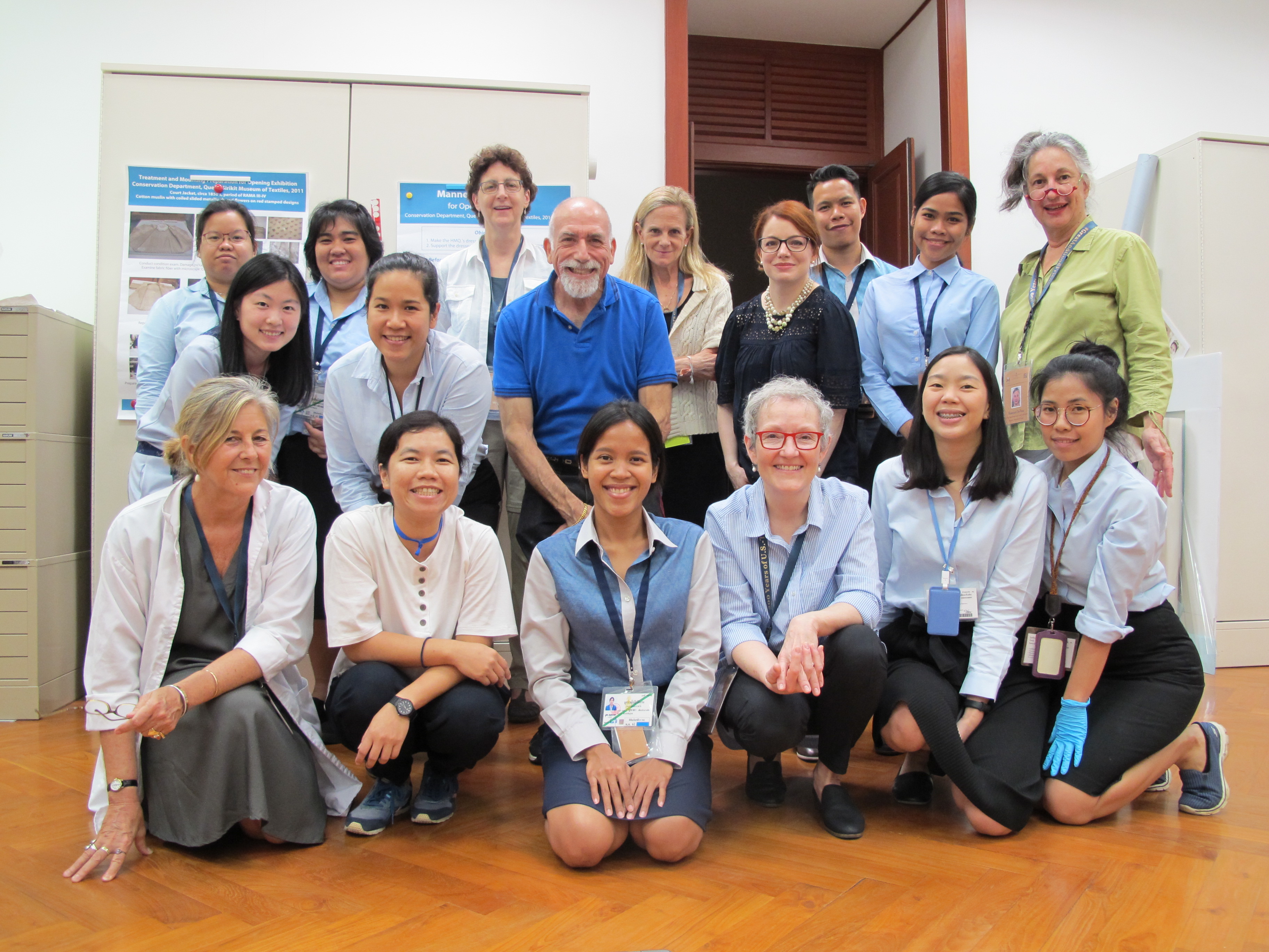 Members of the Queen Sirikit Museum of Textiles exhibit loan international install team pose in Bangkok, Thailand