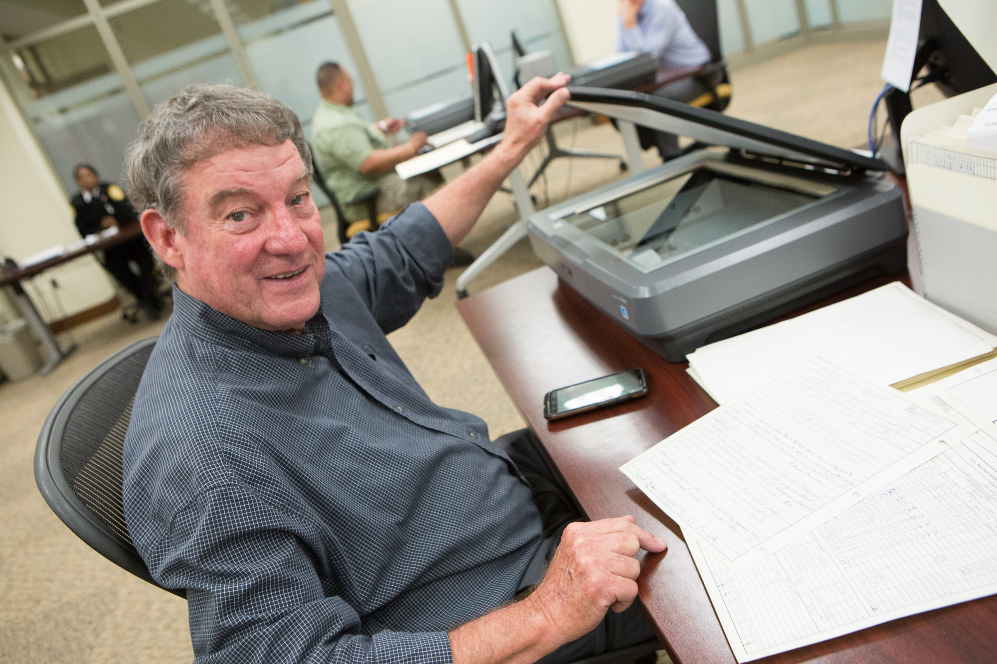 Tom Livingston, former commander of the Point Slocum, points to his signature on a logbook page